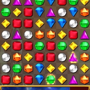 A screenshot of Bejeweled gameplay, showing a colorful grid of sparkling gems ready to be matched.