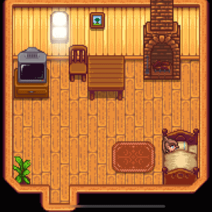 A Stardew Valley in-game screenshot showing a cozy, pixel-art-style interior with wooden floors and furniture.